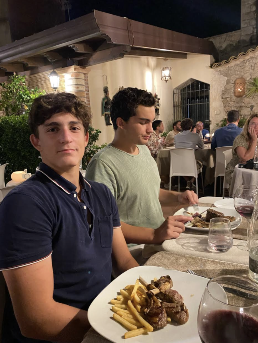 Courtesy of Nicholas Sachman | Matteo Sachman — an avid traveler — and his brother Nicholas (SFS ’25) enjoy a meal in Taormina, Sicily.